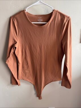 Nuuds long sleeve crewneck bodysuit color clay, size large.